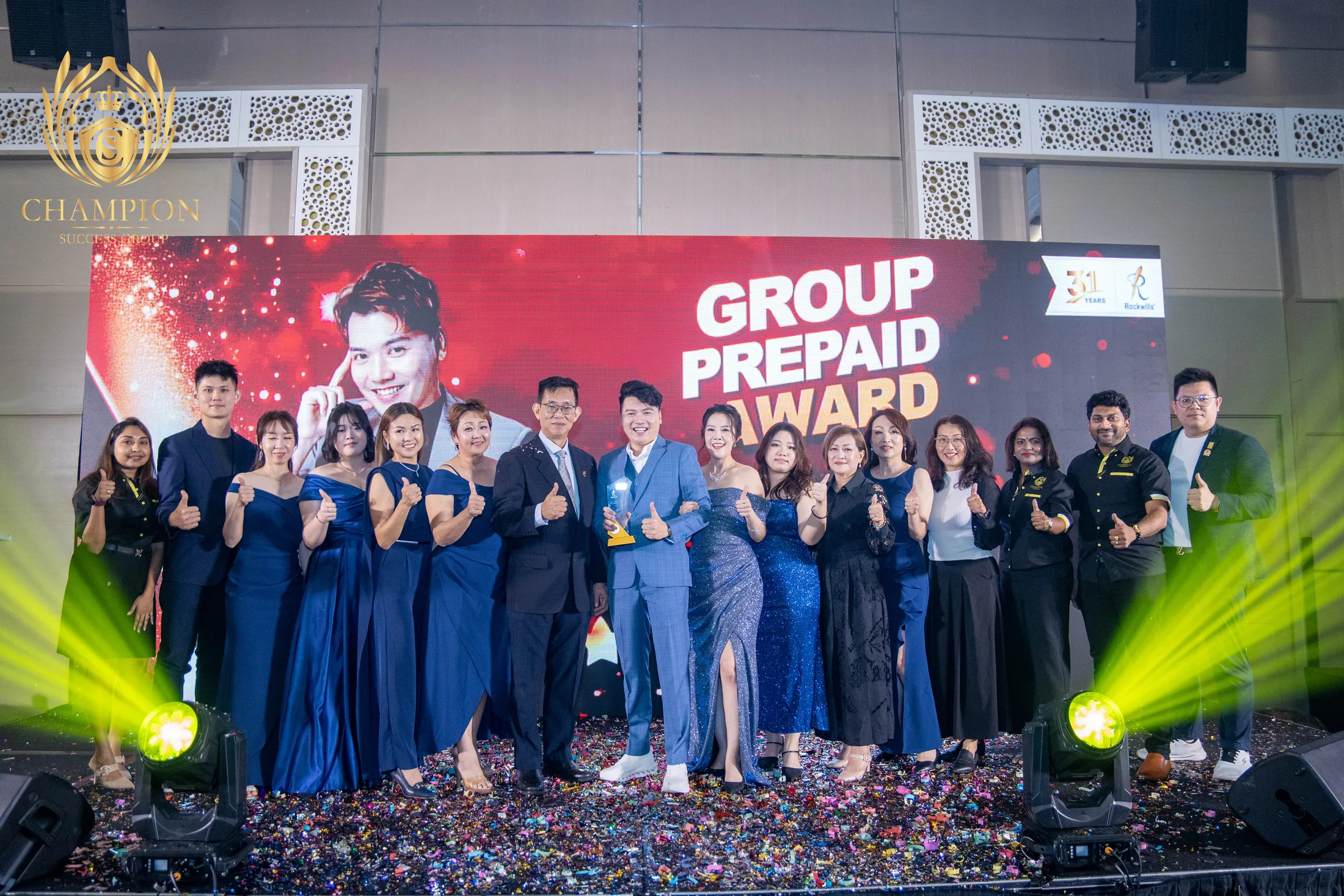 Champion Success Group award-winning Rockwills team on stage
